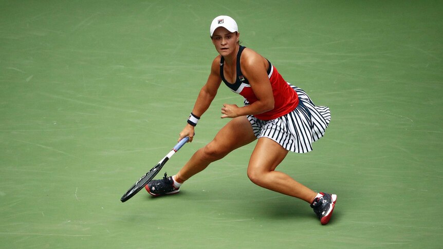 Ash Barty slides around the court at the US Open