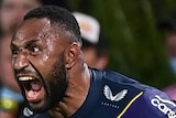 A Melbourne Storm NRL players screams as he celebrates a try against Manly.