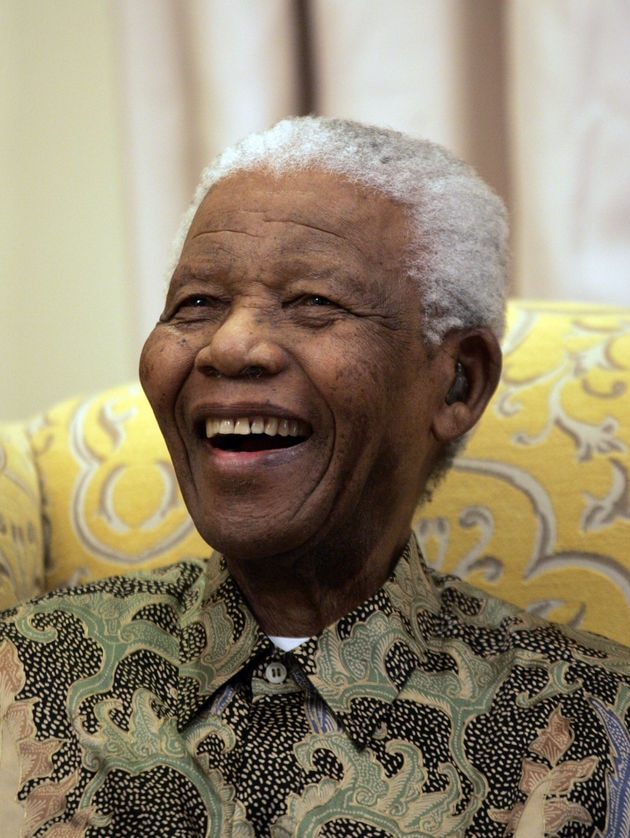 Former South African president Nelson Mandela laughs during an interview