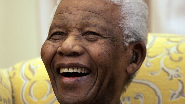 Nelson Mandela laughs during an interview