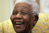 Former South African president Nelson Mandela laughs during an interview
