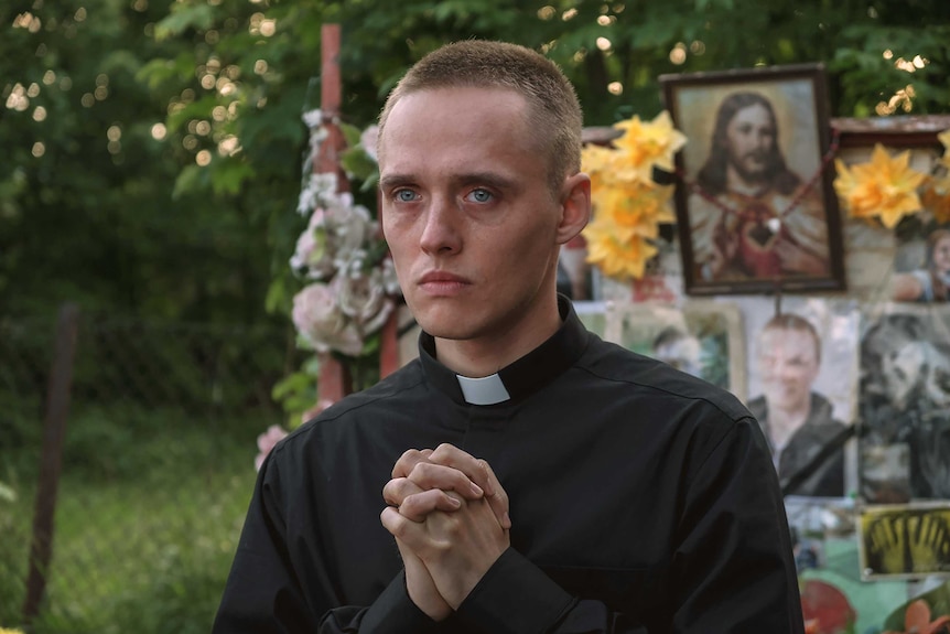 A scene from the film Corpus Christi with a young man in priest's clothes