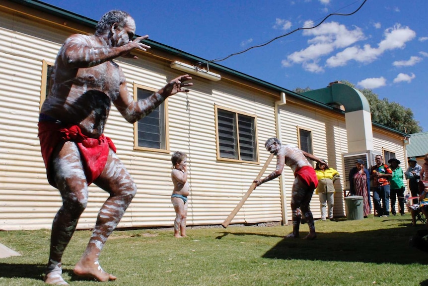 Barkinji man Christopher Quale performs a traditional dance after the repatriation at Kinchega National Park.