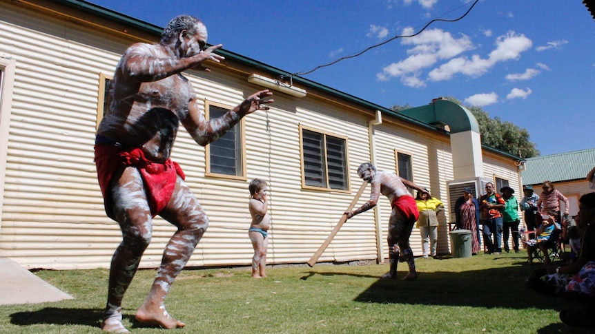 Barkinji man Christopher Quale performs a traditional dance after the repatriation at Kinchega National Park.