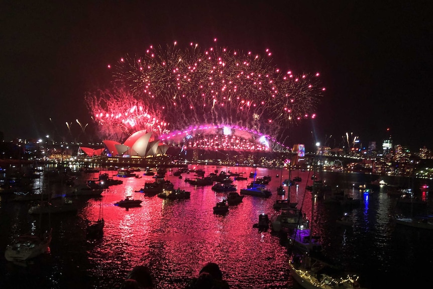 Boats by Sydney harbour overlooking the fireworks display for New Years.