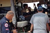 Rescued British backpacker Samuel Woodhead sitting in the North Queensland Rescue Helicopter.