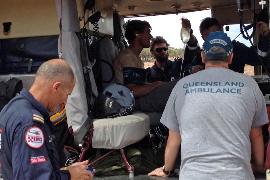 Rescued British backpacker Samuel Woodhead sitting in the North Queensland Rescue Helicopter.