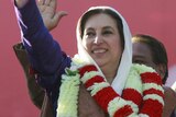 Benazir Bhutto waves during an election rally shortly before she was killed. (File photo)