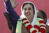Pakistan's former prime minister and opposition leader Benazir Bhutto waves during an election rally