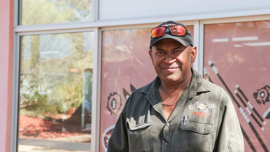 A Aboriginal man stares down the camera