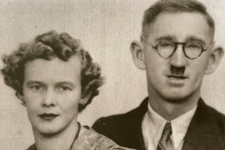 A black and white photo of a man and a woman