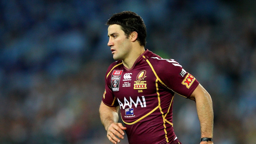 Cooper Cronk of the Maroons walks off to the sin bin during game two of the ARL State of Origin