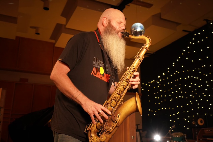 A man playing a saxophone