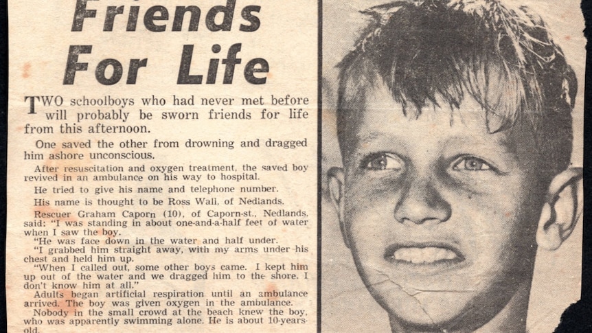newspaper article with smiling boy in photo