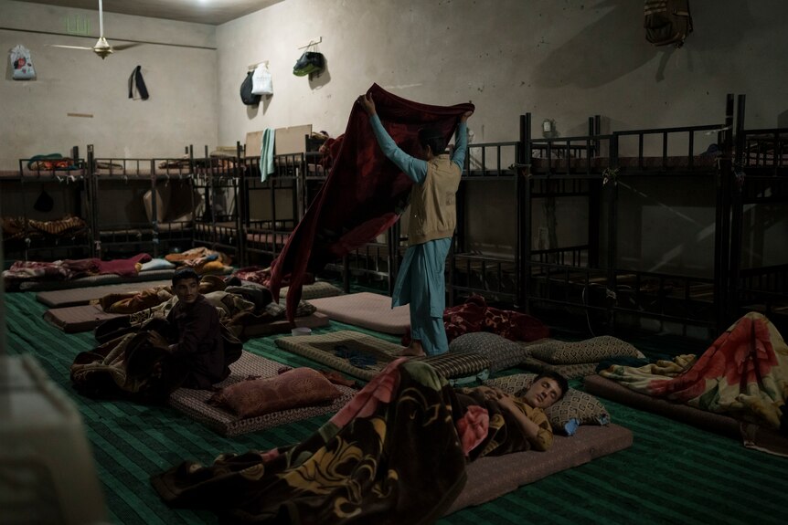Madrassa students sleep on thin mattresses in Kabul