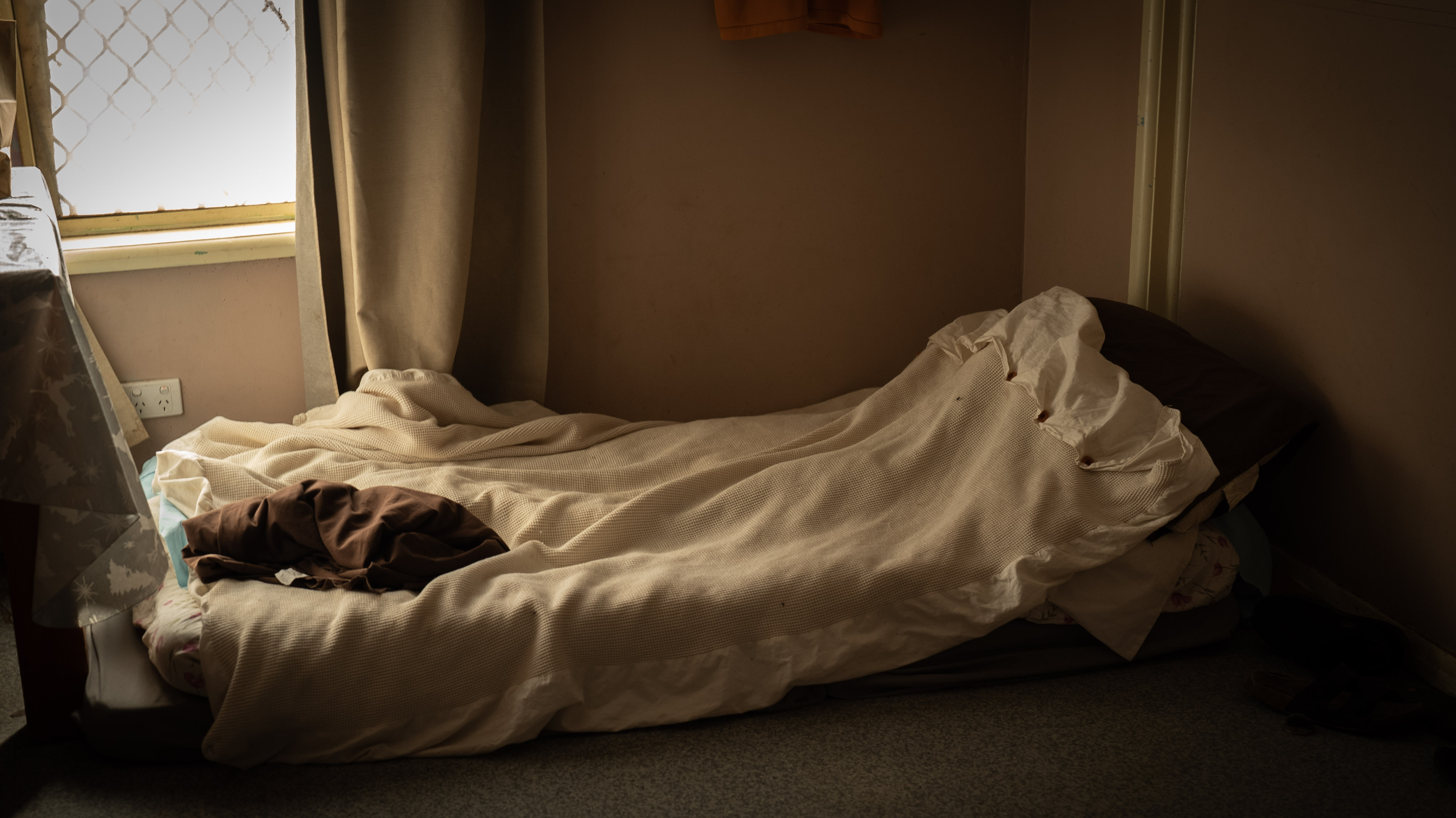 A bed on the floor. 