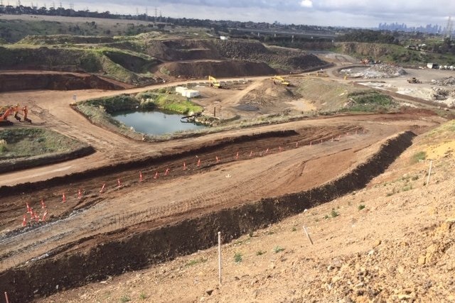 a wide shot of a landfill site.