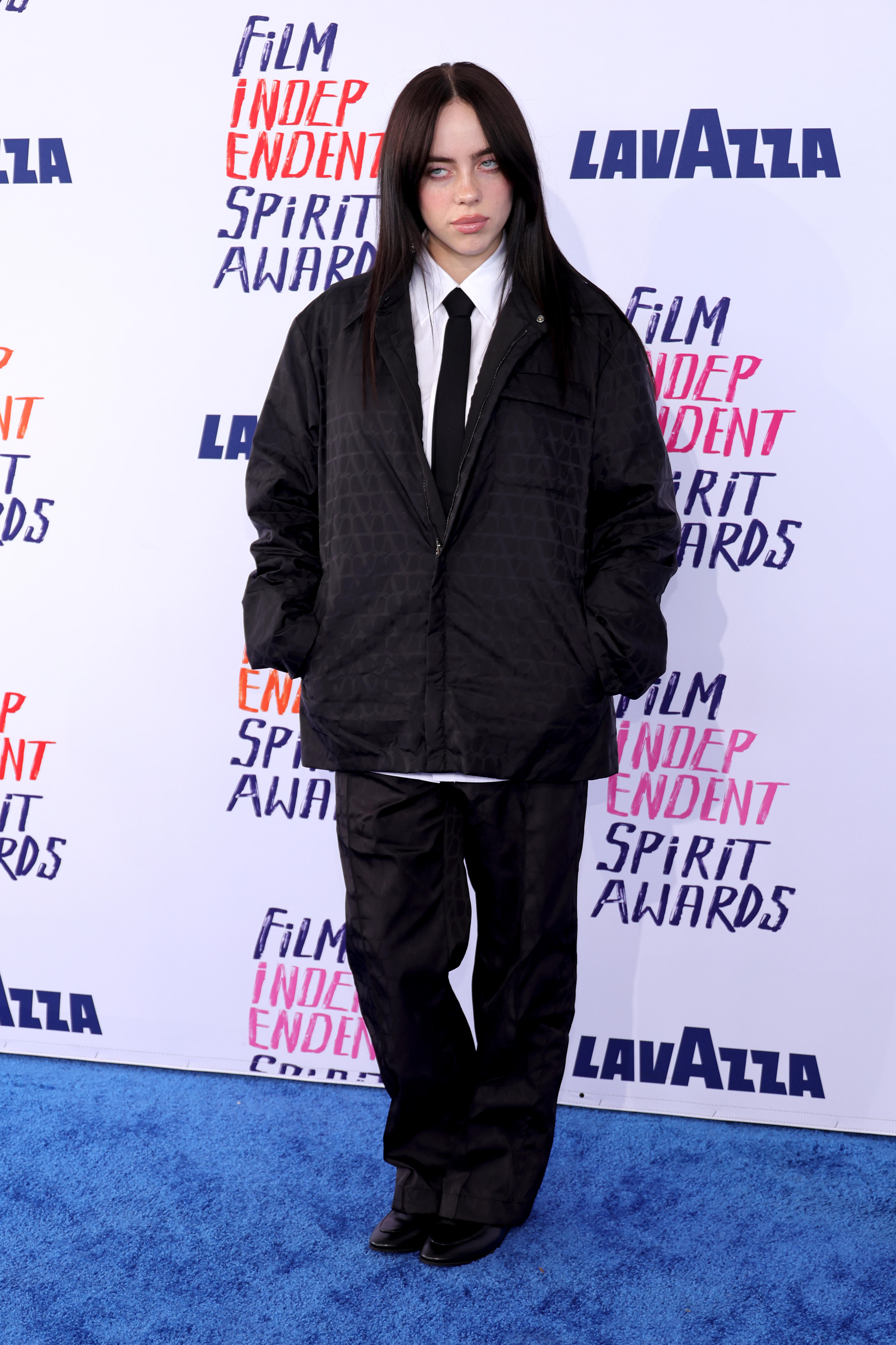 Billie Eilish poses on the red carpet at the Independent Spirit awards