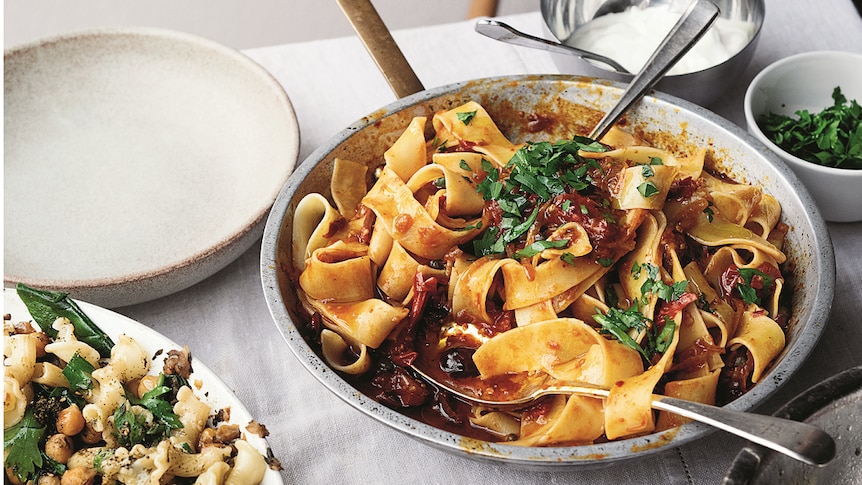 Pappardelle with rose harissa, black olives and capers, alongside gigli with chickpeas and za'atar.