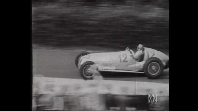 Old photo of racing car on track