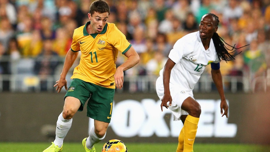 Australia's Tommy Oar contests the ball against South Africa in May 26, 2014.