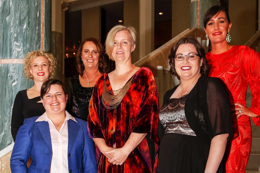 The six state and territory finalists for the 2017 Rural Women's Award pose on the steps in Parliament House's Marble Foyer.