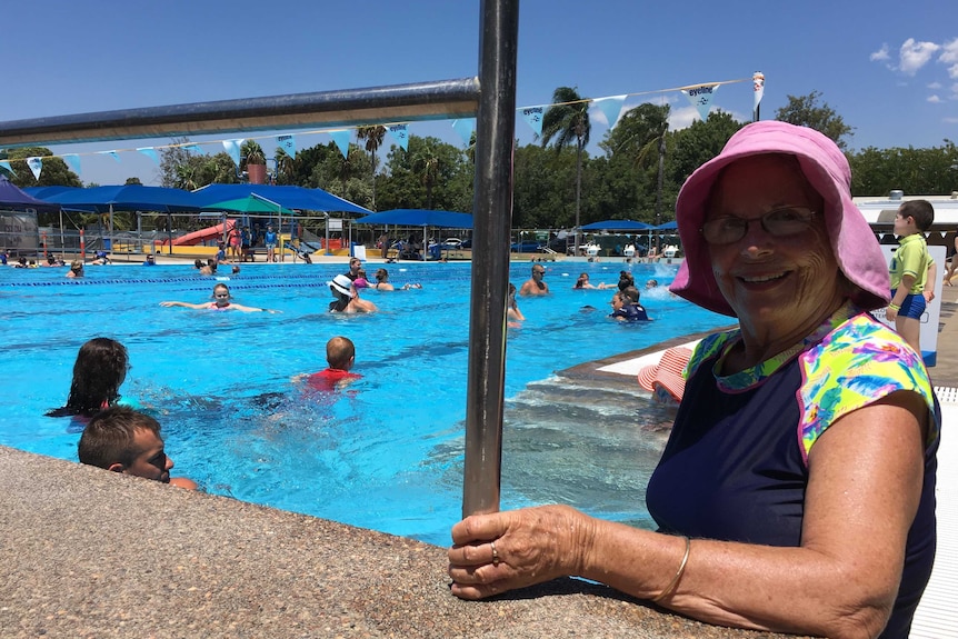 Deann Mitchell stands at the edge of the Maitland pool on a hot day.
