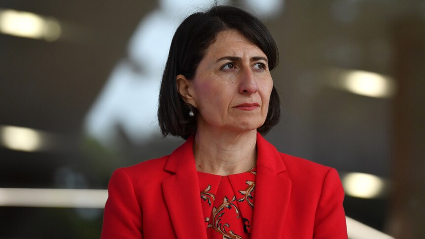 New South Wales Premier Gladys Berejiklian wearing red, fronting up to a coronavirus media conference.