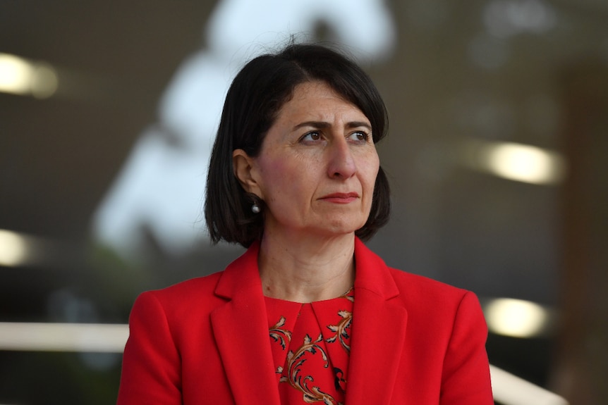 New South Wales Premier Gladys Berejiklian wearing red, fronting up to a coronavirus media conference.