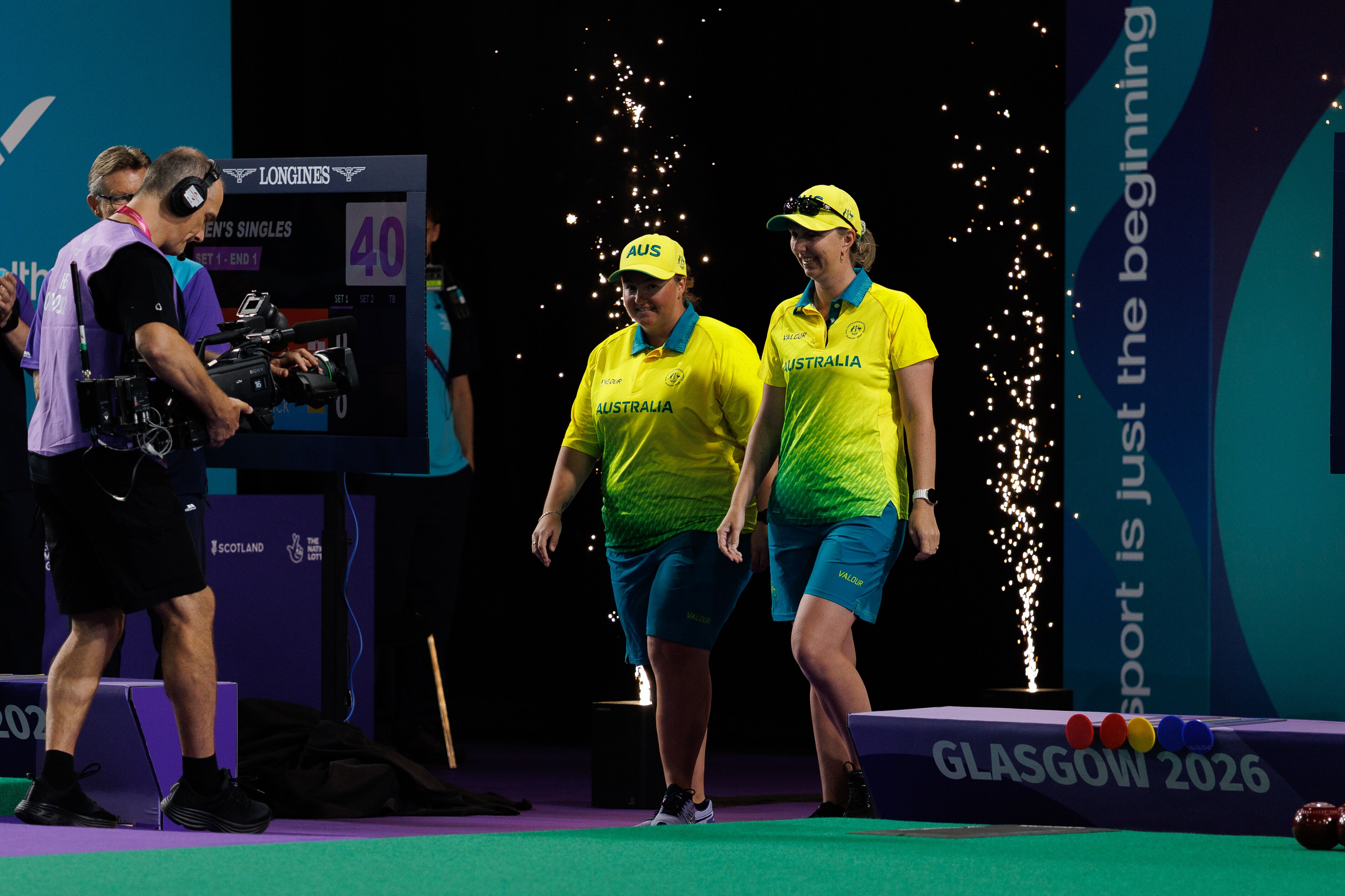 Dawn Hayman and Kelsey Cottrell walk out to the bowls at the 2026 Glasgow Commonwealth Games.