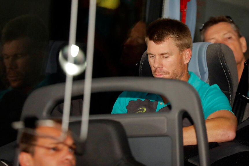 Australia's David Warner sits on the team bus