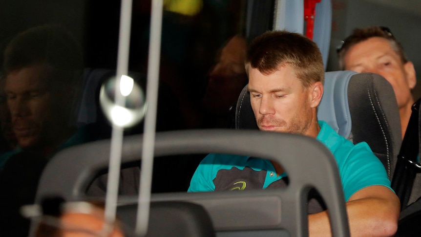 Australia's David Warner sits on the team bus