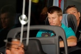 Australia's David Warner sits on the team bus