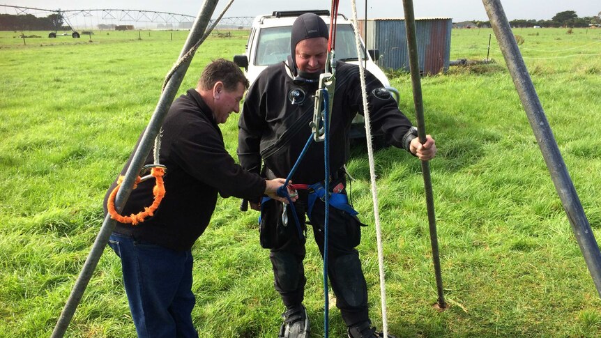Gary Barclay preparing to lower diver and farmer Kelvyn Ball into The Shaft