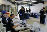 Queensland police work during a 'drug destruction day'
