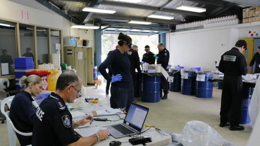 Queensland police work during a 'drug destruction day'