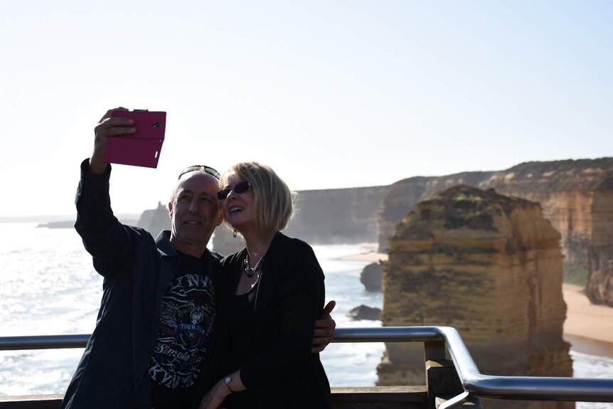 Tourists take selfies on the Great Ocean Road