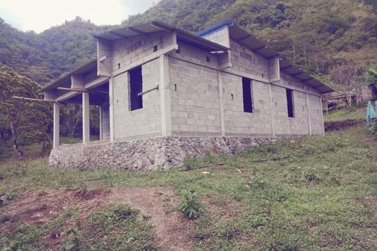 Image of Timorese worker Acacio's house under construction in Timor-Leste.