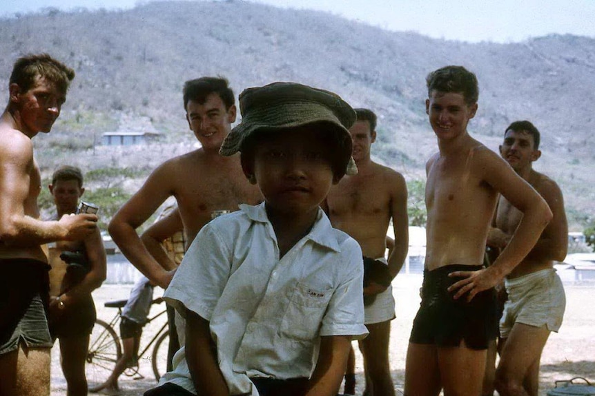 Aussie soldiers play Aussie Rules footy with local kids in Vung Tau, 1968.