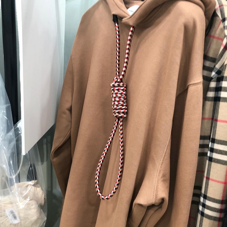 A brown hooded jumper with a noose hanging from the hood.