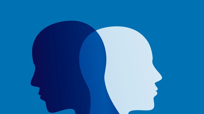 Silhouette overlay of two heads outlined against blue background