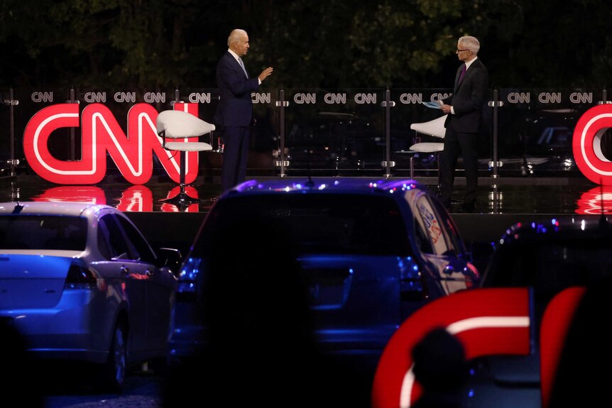 Democratic U.S. presidential nominee and former Vice President Joe Biden speaks next to CNN host Anderson Cooper