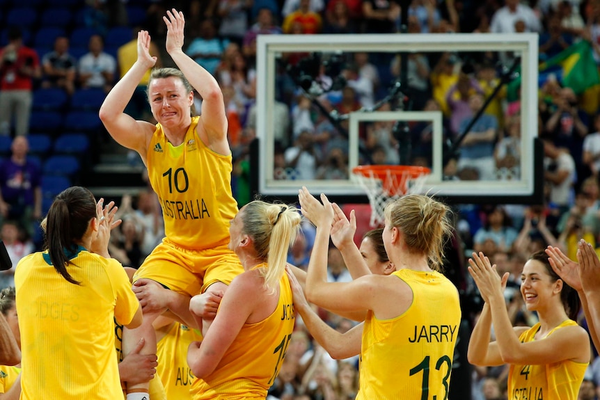 Kristi Harrower is lifted in the air by team-mates after Australia won bronze.