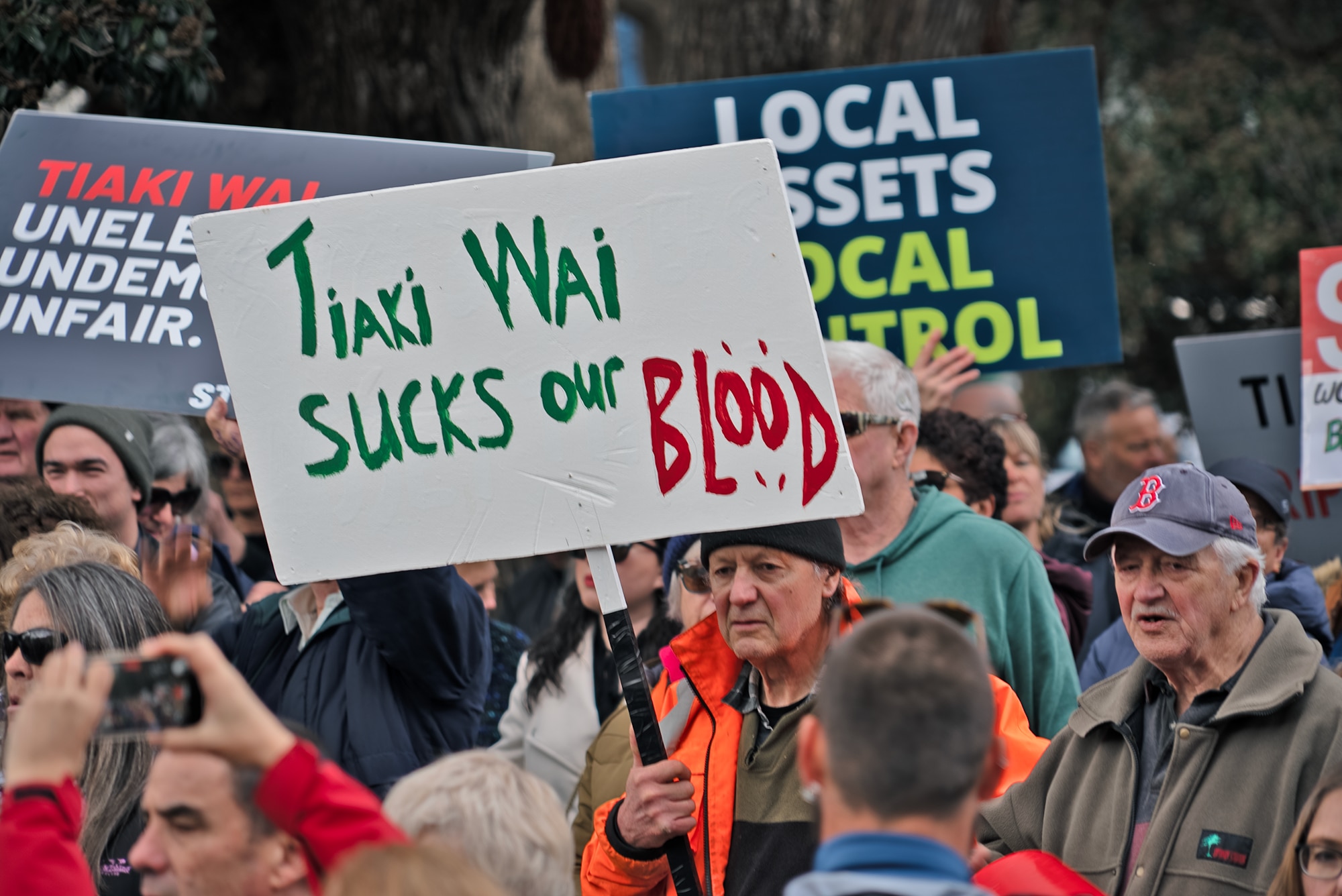 A protest involving people opposing development.