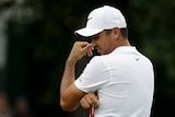 Jason Day looks on in anguish