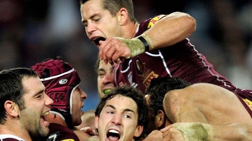 Queensland players celebrate Billy Slater's match-winning try