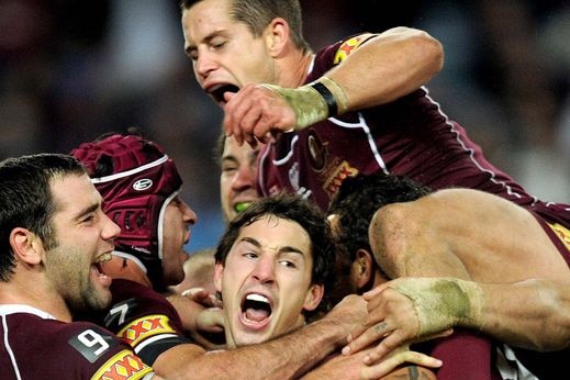 Queensland players celebrate Billy Slater's match-winning try