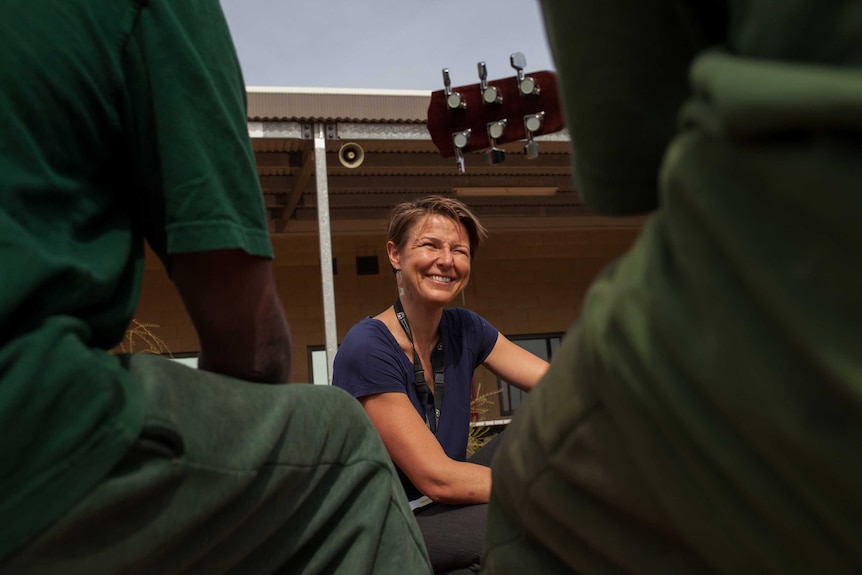 Prison educator Ange Leech watches two inmates play at Eastern Goldfields Regional Prison.