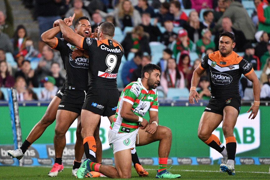Wests Tigers' Esan Masters celebrates try against Rabbitohs