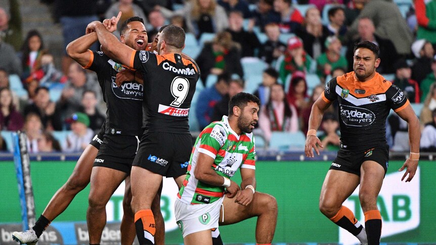 Wests Tigers' Esan Masters celebrates try against Rabbitohs